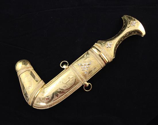 A Saudi Arabian antique Persian style high carat gold and diamond mounted presentation dagger, 11in.